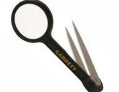 Garrett Magnifier And Tweezers Set For Gold Prospecting The Garrett Tweezer and Magnifier Set is a useful tool for gold prospecting, designed to assist in picking up small gold nuggets and inspecting fine details with the built-in magnifier. Here's a breakdown of its key features: Stainless Steel Tweezers: Ideal for picking up small gold particles, especially from crevices and hard-to-reach places. Integrated Magnifier: Enhances your ability to see fine details, making it easier to inspect tiny nuggets or other finds during metal detecting or gold panning. Compact Design: This combo tool is lightweight and portable, perfect for taking along on treasure-hunting trips. The tweezers with magnifier are an affordable and practical addition to any prospector’s toolkit.